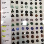 A display case filled with gemstone dice