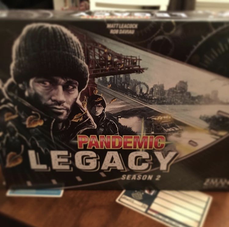 Box for Pandemic Legacy Season 2 (Black), with some game pieces which are blurred out to prevent spoilers!